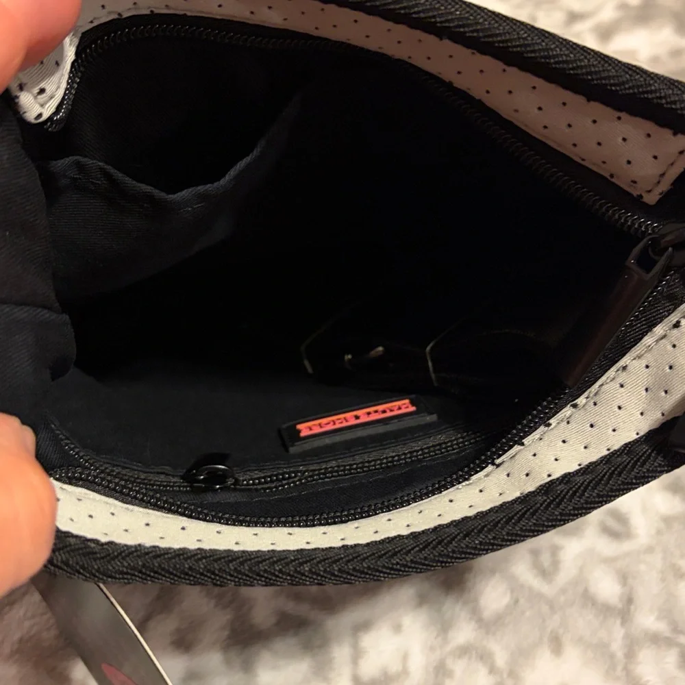 Haute shore brand.  Trendy Black and Gray Crossbody Bag with Pink Accents - Picture 3 of 8